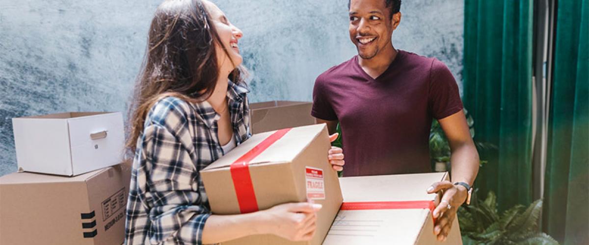 Moving out tips with Girl carrying boxes